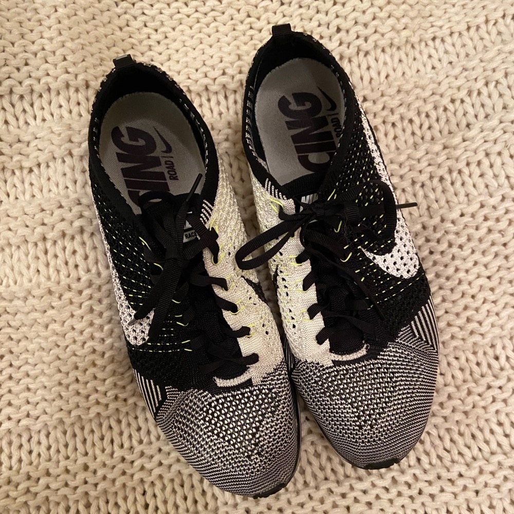 Gently worn Nike FlyKnit Racer in Orca/Volt!